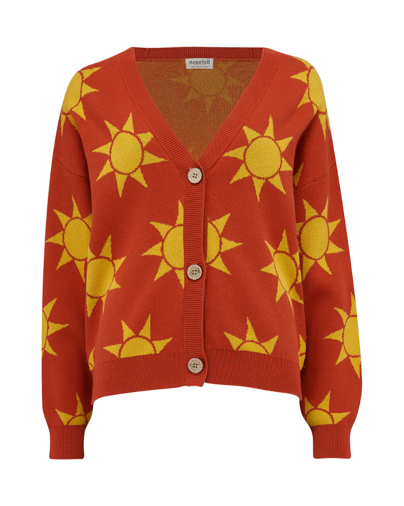 Red cardigan with yellow sun patterns on a white background