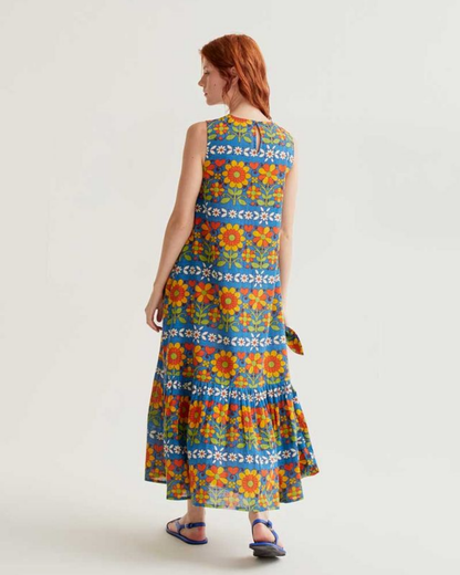 Woman wearing a colorful floral dress on a white background
