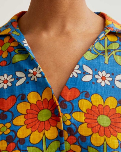 Close-up of a colorful floral-patterned shirt with a deep neckline.