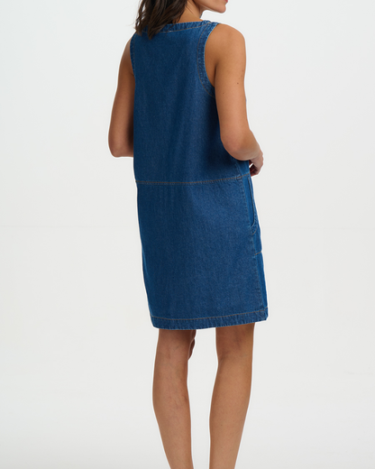 Blue denim dress worn by a person on a white background