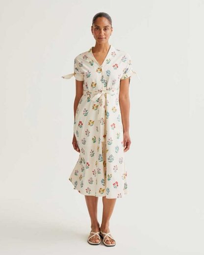 Woman wearing a floral dress on a white background