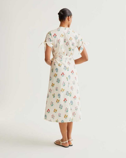 Woman wearing a floral dress on a white background