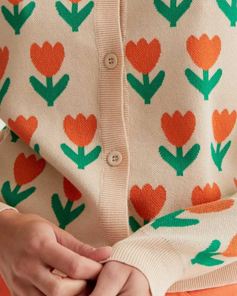 Close-up of a sweater with orange tulip pattern