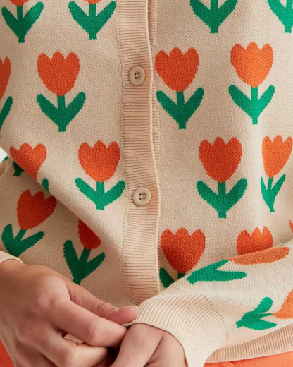 Close-up of a sweater with orange tulip pattern