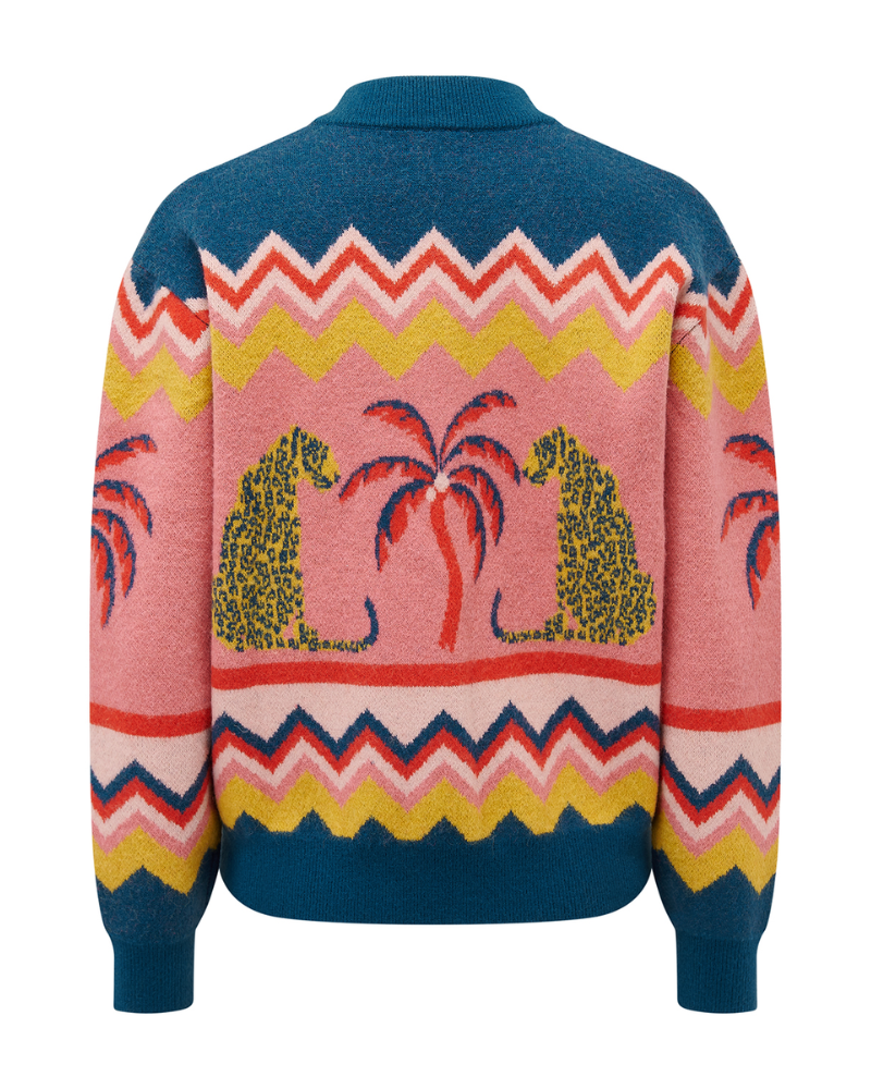 Colorful sweater with tropical design on a white background