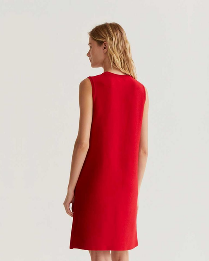 Red dress worn by a person on a white background