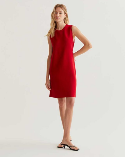 Woman wearing a red dress on a white background