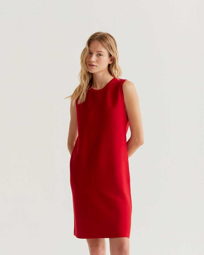 Woman wearing a red dress on a white background